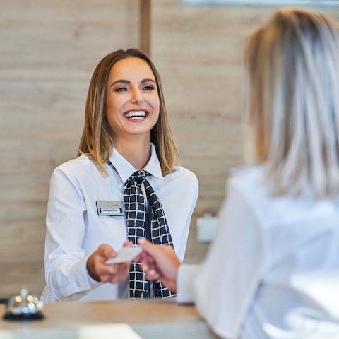 Associate helping a customer at the front desk